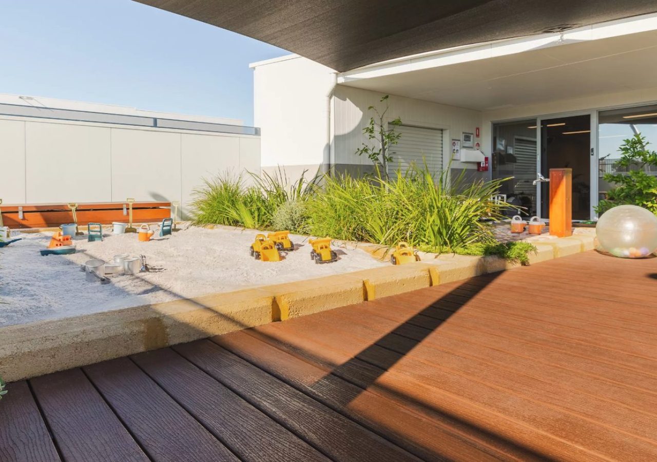 Kewdale Early Learning Centre landscaping - timber decking beside the sandpit