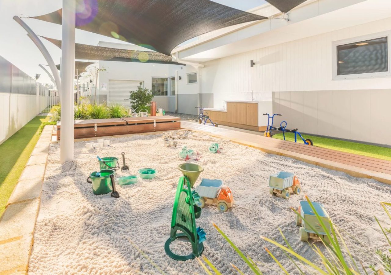 Kewdale Early Learning Centre landscaping - sandpit with water pump play elements